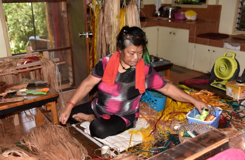 Last grass skirt maker of Palau at work