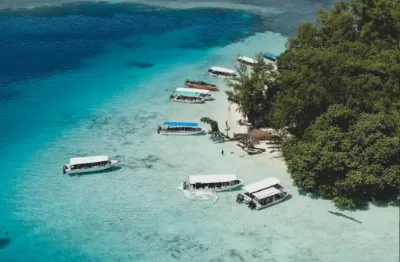 Aerial photo of boats along a beach in Palau